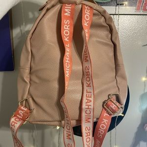 nude colored michael kors mini bag